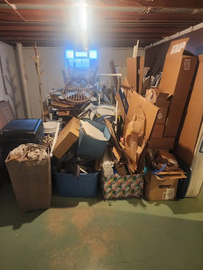 Roll-off dumpster container at job site for 2 Yard Dumpster Rental in Baraga